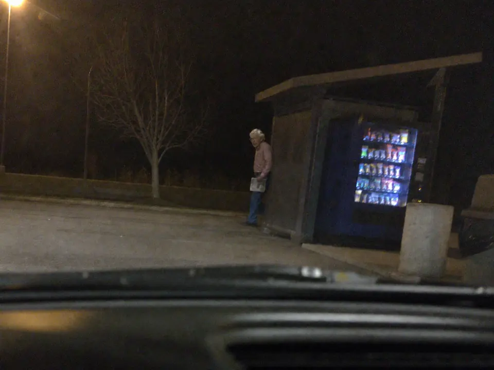 Satirical fake night sighting of a Mitch-like figure near a rest-stop vending machine